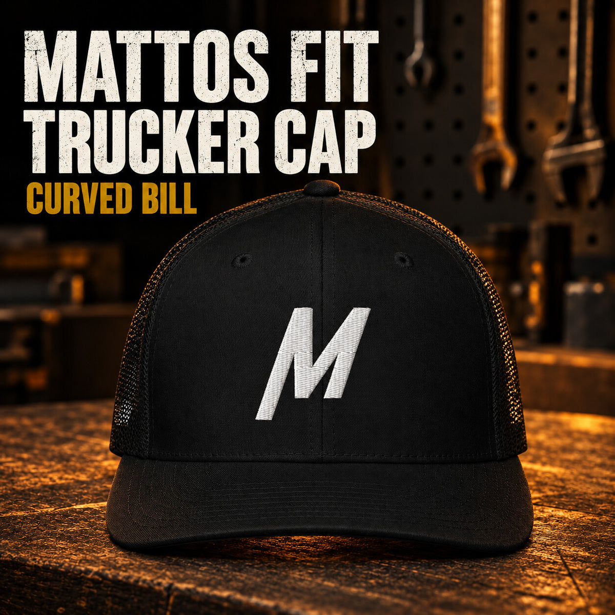 Black Mattos Fit trucker cap with a curved bill, mesh sides and white embroidered M.