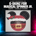 Gilbert Engineering USA G-SkinZ for the Magical Spinner Jr.; santa, overlay shown. Exact photographed product presented on a charcoal background with cyan and magenta accent lighting.