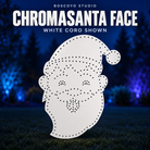 ChromaSanta Face by Boscoyo Studio, original unlit coro prop on a dark blue evening yard background.