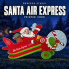 DayCor HiRes Santa Air Express printed coro airplane with Santa and empty pixel holes, unlit on a dark blue evening yard background.