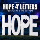 Boscoyo HOPE 4-foot letters, four separate white coro letters with empty pixel holes and heart-shaped P, unlit on a dark blue evening yard.