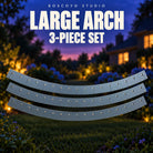 Boscoyo Studio Large Arch three-piece set of bare dark gray coro segments, showing the original pixel and mounting openings against a dusk garden.