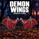 DayCorO Demon Wings printed coro pair, showing the original red and mauve artwork and unlit pixel holes.