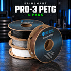 SainSmart PRO-3 PETG four-pack with black, white, brown and silver filament on four cardboard spools.